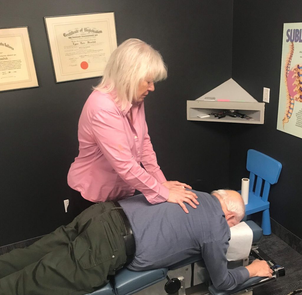 dr-lynne-with-senior-man-burlington-chiropractor