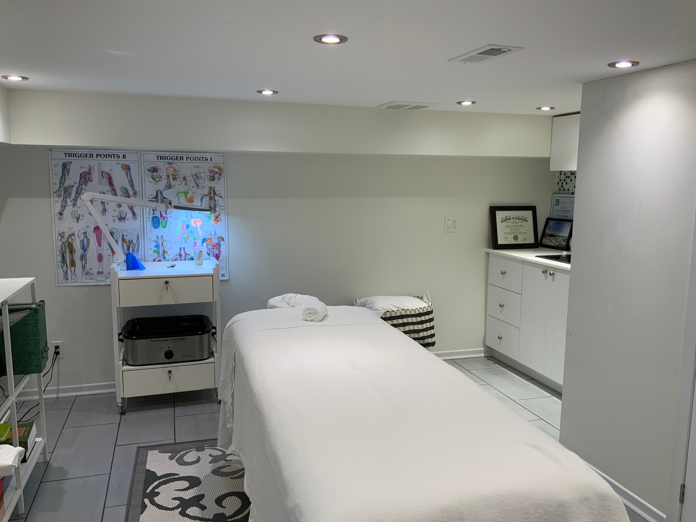 Treatment table and CMTO certificate at Cypri Massage Therapy, Toronto