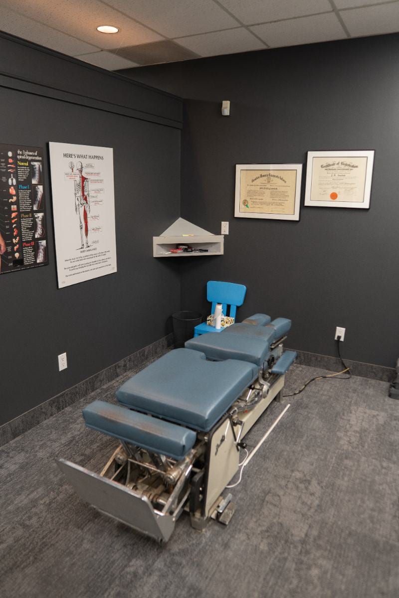 Chiropractic adjustment table in a treatment room at Life Chiropractic Centre, Burlington